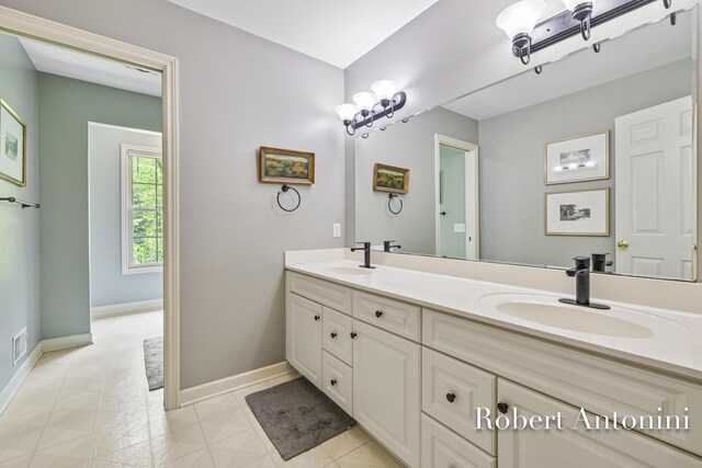 6374 Blakely Dr NE, Rockford, MI 49341 - full bath with double vanity and baseboards