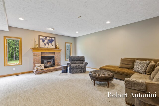 6374 Blakely Dr NE, Rockford, MI 49341 - living room with baseboards, a textured ceiling, carpet flooring, and recessed lighting