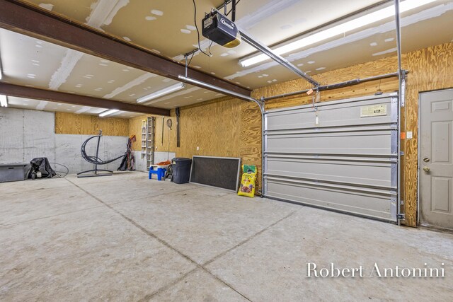 6374 Blakely Dr NE, Rockford, MI 49341 - garage featuring a garage door opener