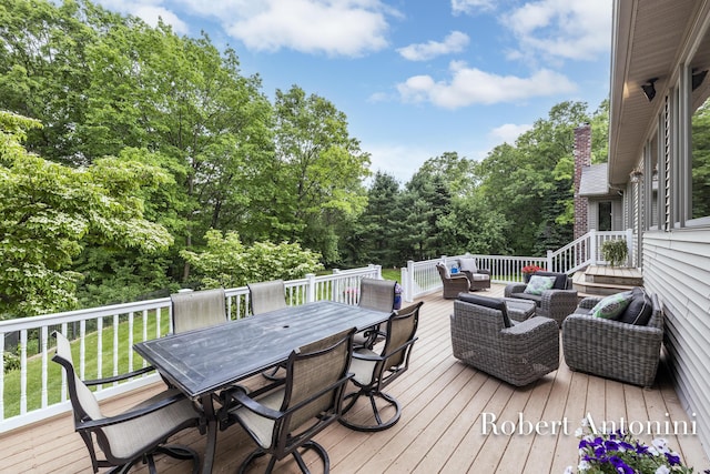 6374 Blakely Dr NE, Rockford, MI 49341 - wooden terrace featuring outdoor lounge area, outdoor dining area, and view of scattered trees