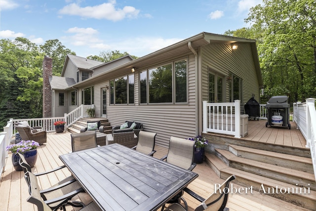 6374 Blakely Dr NE, Rockford, MI 49341 - wooden terrace featuring outdoor dining area, grilling area, and an outdoor living space