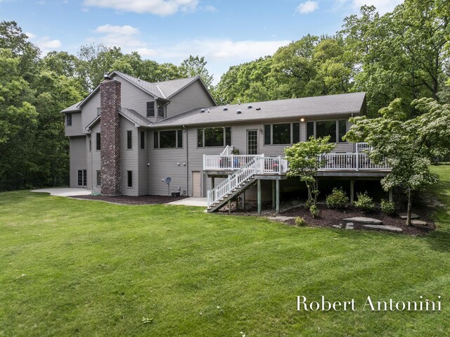 6374 Blakely Dr NE, Rockford, MI 49341 - rear view of property with a wooden deck, a chimney, stairway, and a lawn