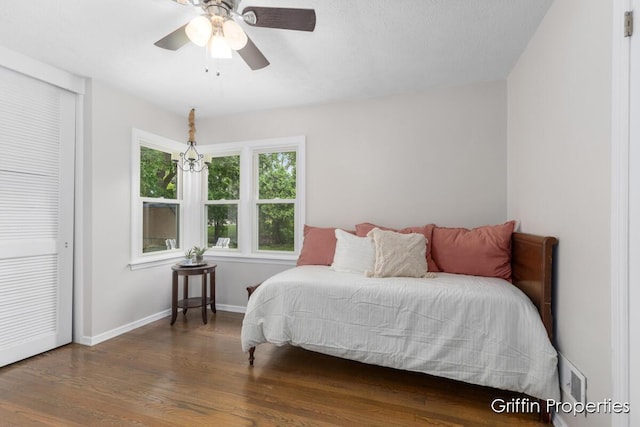 3020 Cascade Rd SE, Grand Rapids, MI 49506 - bedroom featuring wood finished floors, baseboards, and a ceiling fan