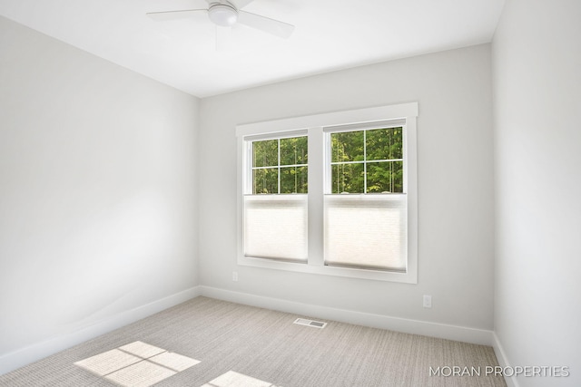 12607 76th Ave, Allendale, MI 49401 - carpeted spare room featuring baseboards and a ceiling fan