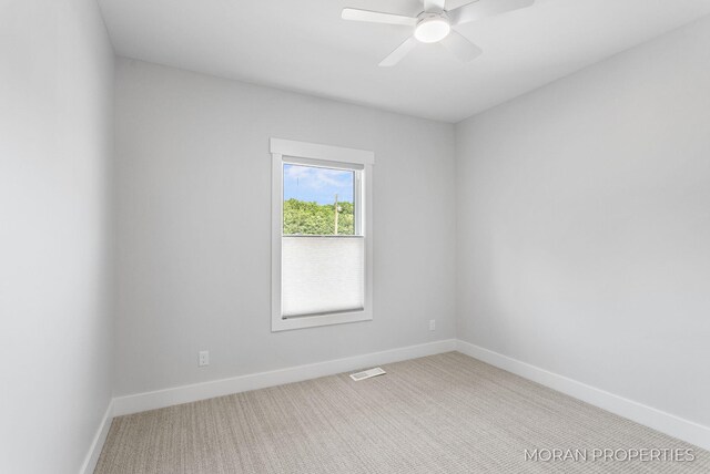 12607 76th Ave, Allendale, MI 49401 - empty room featuring carpet flooring, baseboards, and ceiling fan