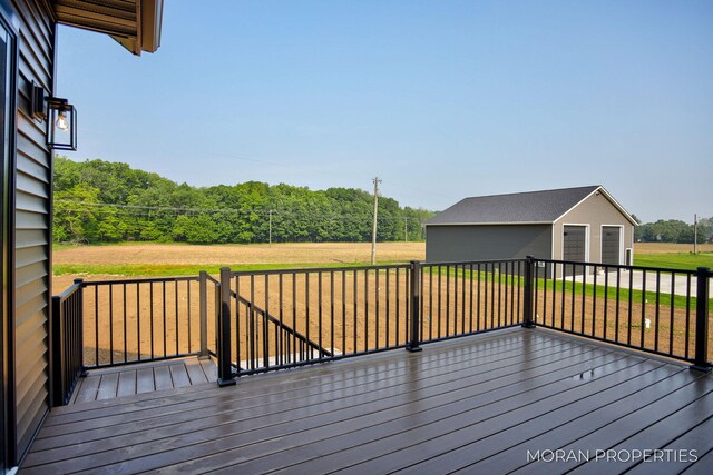 12607 76th Ave, Allendale, MI 49401 - wooden terrace with a garage and an outbuilding