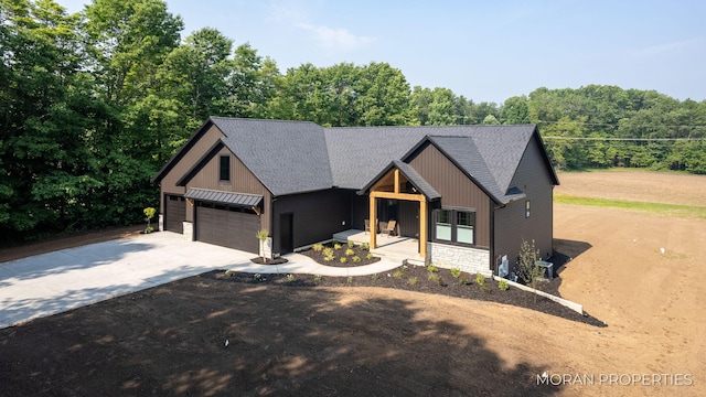 12607 76th Ave, Allendale, MI 49401 - modern farmhouse style home featuring driveway, board and batten siding, stone siding, and roof with shingles