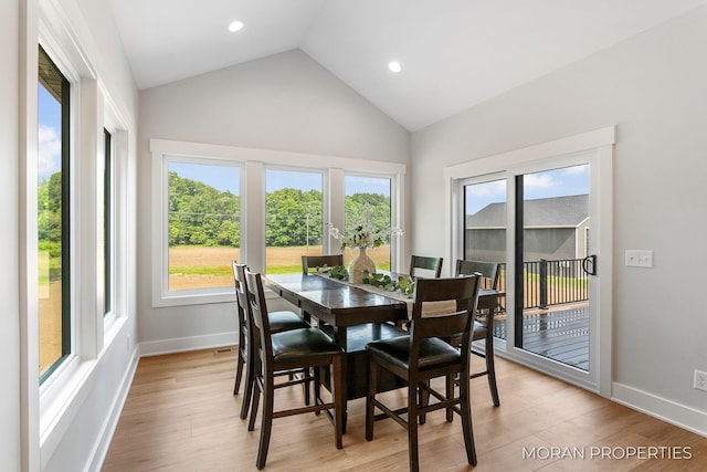 12607 76th Ave, Allendale, MI 49401 - dining space with plenty of natural light, light wood-style floors, baseboards, recessed lighting, and high vaulted ceiling