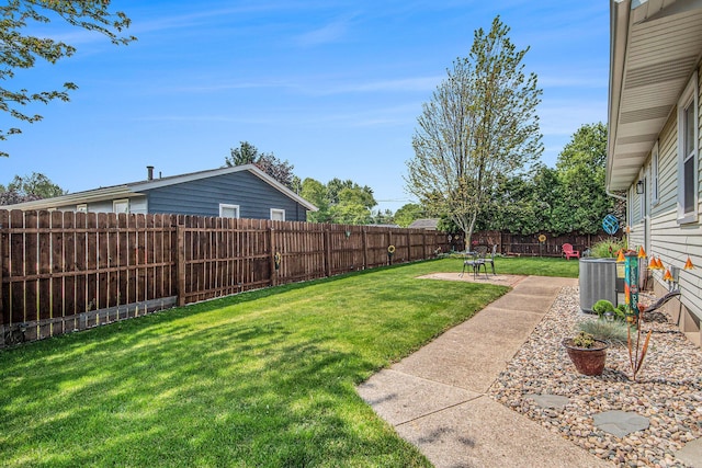 2700 Norfolk Rd SE, Grand Rapids, MI 49506 - view of yard featuring central AC unit and a patio area