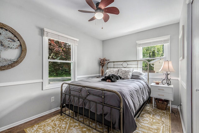 2700 Norfolk Rd SE, Grand Rapids, MI 49506 - bedroom featuring wood finished floors, baseboards, and a ceiling fan