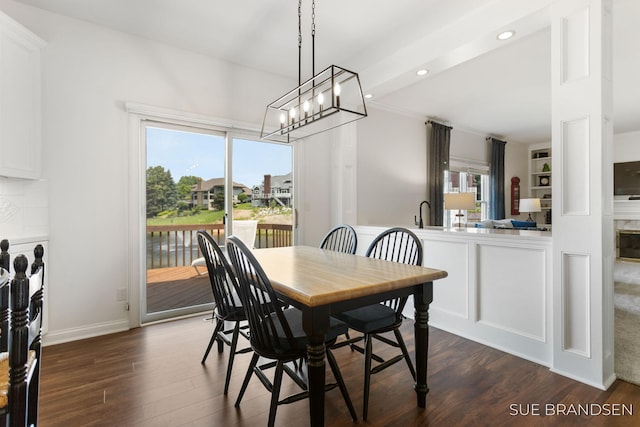 933 Meadow Ridge Dr, Holland, MI 49424 - dining room featuring dark wood-type flooring, a chandelier, and recessed lighting