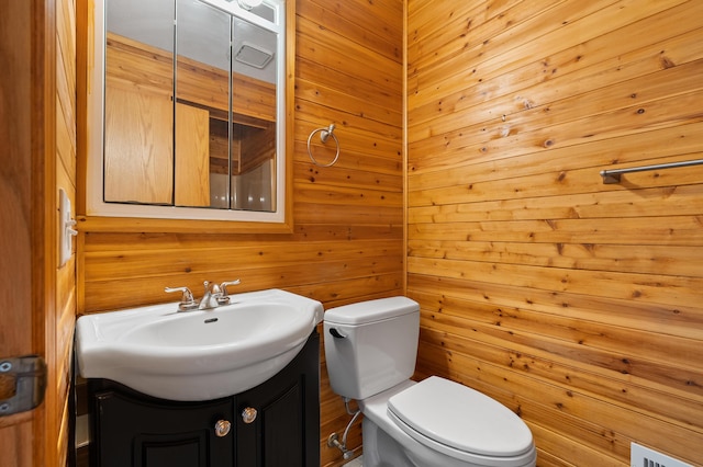 125 Wa Wee Nork Dr Unit 109-5-A, Battle Creek, MI 49015 - half bath featuring toilet, vanity, and wooden walls