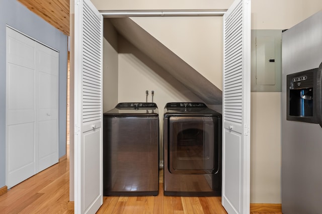 125 Wa Wee Nork Dr Unit 109-5-A, Battle Creek, MI 49015 - laundry room featuring washer and clothes dryer, electric panel, and light wood-type flooring