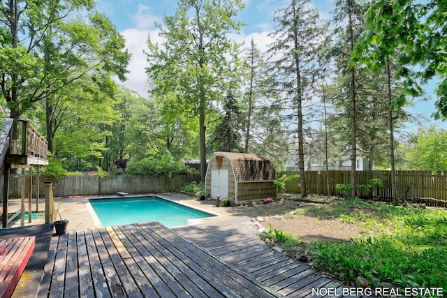 1710 Dykhouse Ave, Grand Haven, MI 49417 - view of swimming pool featuring a fenced backyard, a wooden deck, and a diving board