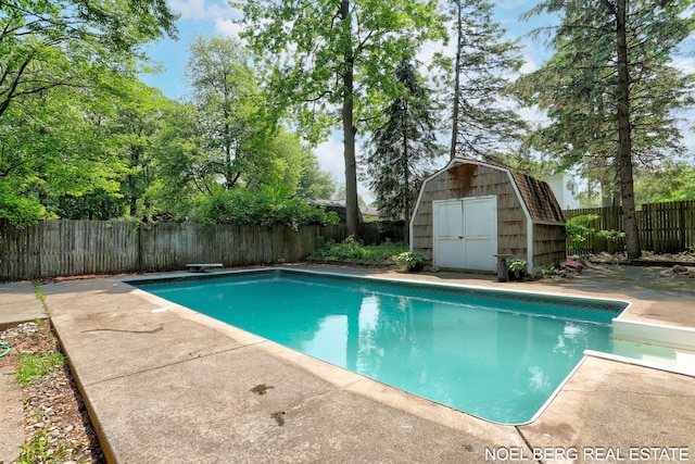 1710 Dykhouse Ave, Grand Haven, MI 49417 - view of pool featuring a diving board, a fenced backyard, and a patio