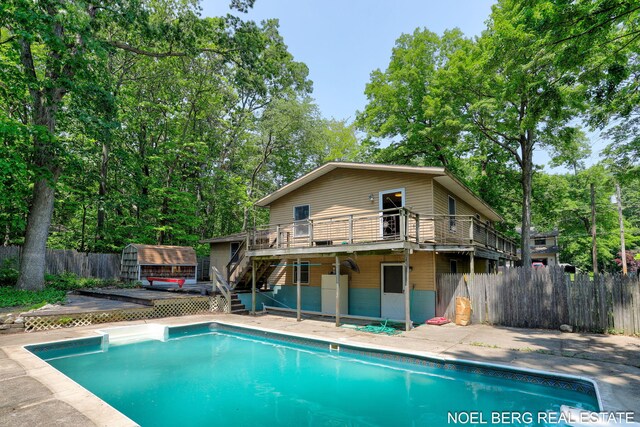 1710 Dykhouse Ave, Grand Haven, MI 49417 - view of swimming pool with a deck and stairway