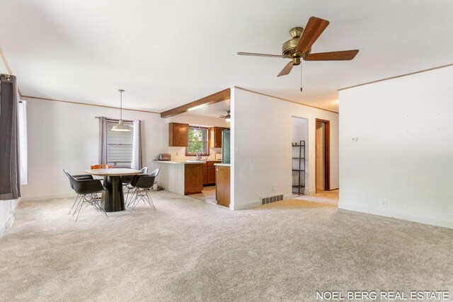 1710 Dykhouse Ave, Grand Haven, MI 49417 - dining area with ceiling fan, light colored carpet, and baseboards