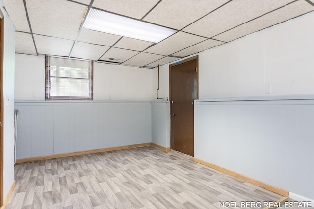 1710 Dykhouse Ave, Grand Haven, MI 49417 - spare room with wood finished floors, wainscoting, and a paneled ceiling
