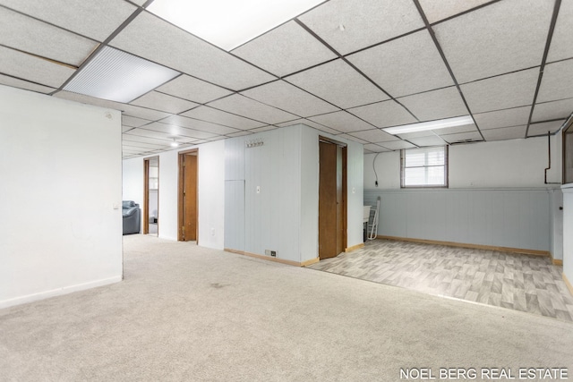 1710 Dykhouse Ave, Grand Haven, MI 49417 - basement featuring carpet, baseboards, and a paneled ceiling
