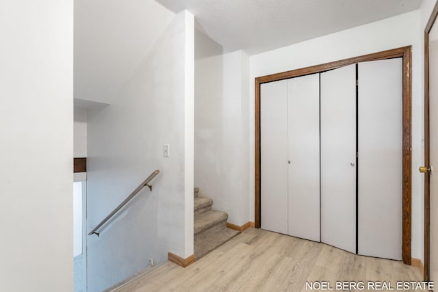 1710 Dykhouse Ave, Grand Haven, MI 49417 - stairway featuring wood finished floors and baseboards