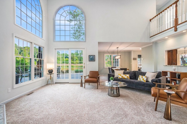 1415 Blackhawk Trl, Benton Harbor, MI 49022 - living room with a high ceiling, carpet floors, plenty of natural light, and crown molding