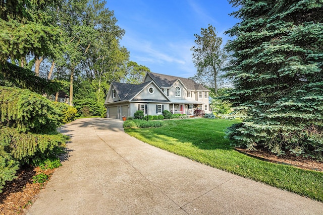 1415 Blackhawk Trl, Benton Harbor, MI 49022 - view of front of property with driveway, a front yard, covered porch, and a garage