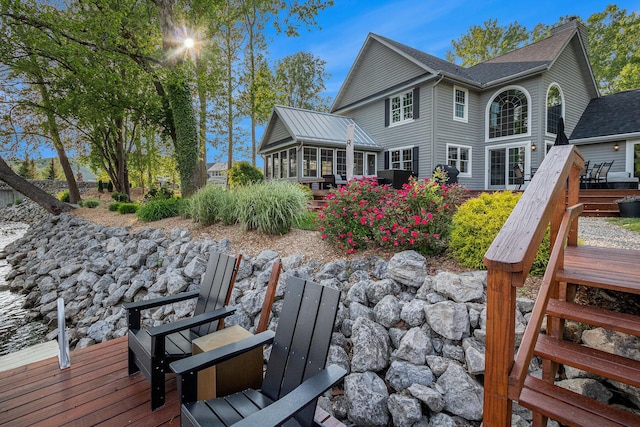1415 Blackhawk Trl, Benton Harbor, MI 49022 - back of house with a sunroom and a wooden deck