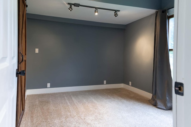 67679 Union Rd, Union, MI 49130 - carpeted empty room featuring rail lighting and baseboards