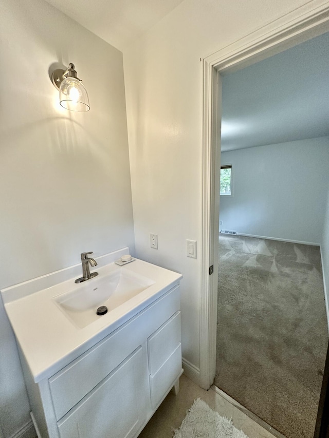 7362 30th St SE, Ada, MI 49301 - bathroom featuring vanity and baseboards