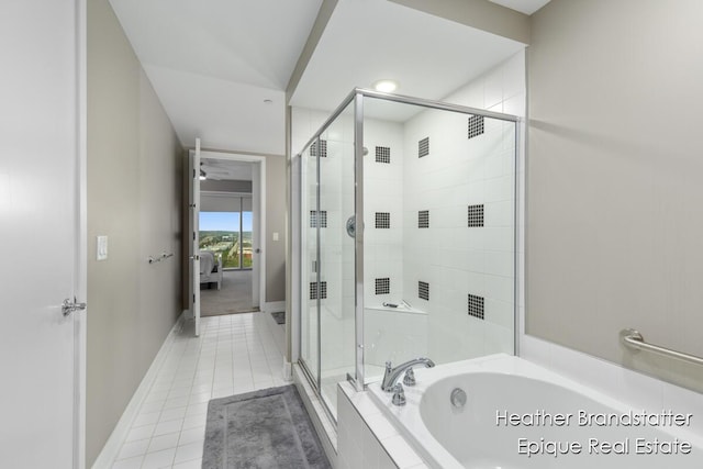 335 Bridge St NW Unit 1101, Grand Rapids, MI 49504 - full bath with a garden tub, a stall shower, tile patterned floors, baseboards, and connected bathroom