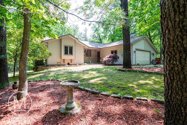 9057 Vergennes St SE, Ada, MI 49301 - ranch-style house with an attached garage and a front yard