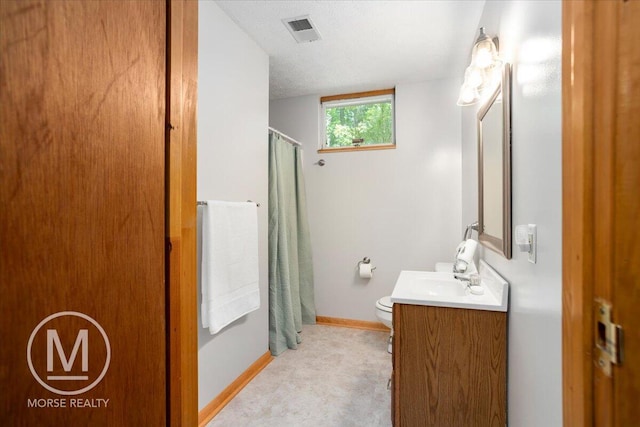 9057 Vergennes St SE, Ada, MI 49301 - bathroom with vanity, toilet, a shower with curtain, and baseboards