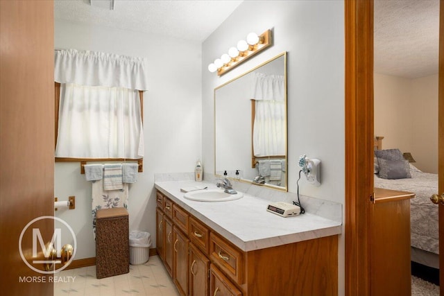 9057 Vergennes St SE, Ada, MI 49301 - bathroom with vanity and a textured ceiling