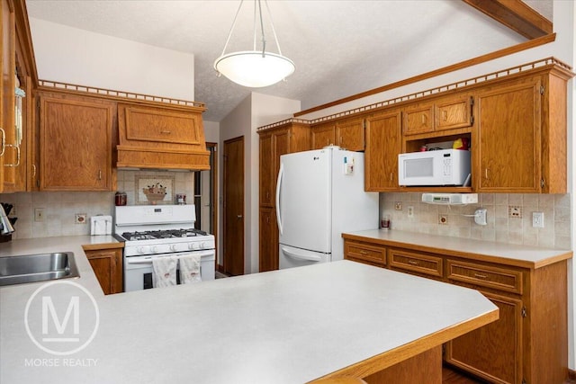 9057 Vergennes St SE, Ada, MI 49301 - kitchen with white appliances, light countertops, brown cabinets, a sink, and decorative backsplash