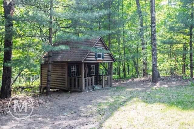 9057 Vergennes St SE, Ada, MI 49301 - view of outbuilding featuring a wooded view