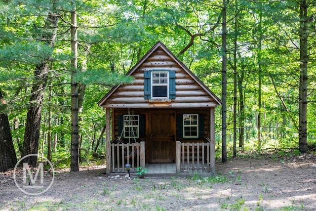 9057 Vergennes St SE, Ada, MI 49301 - view of outbuilding with a forest view