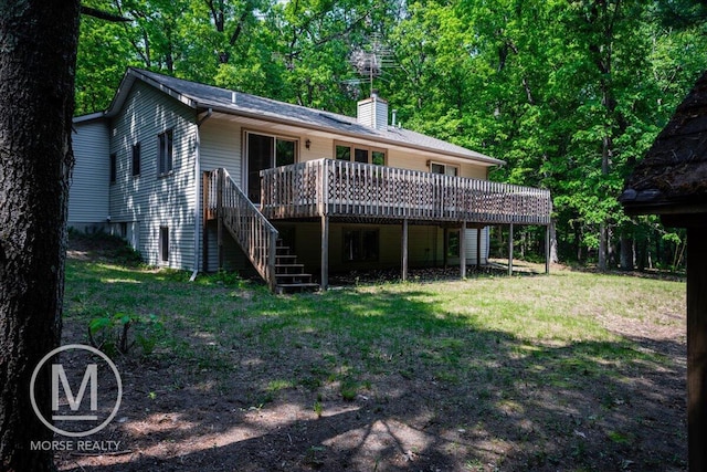 9057 Vergennes St SE, Ada, MI 49301 - back of property featuring stairway, a wooden deck, a chimney, and a lawn