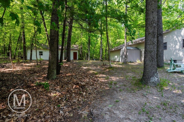 9057 Vergennes St SE, Ada, MI 49301 - view of yard featuring an outdoor structure