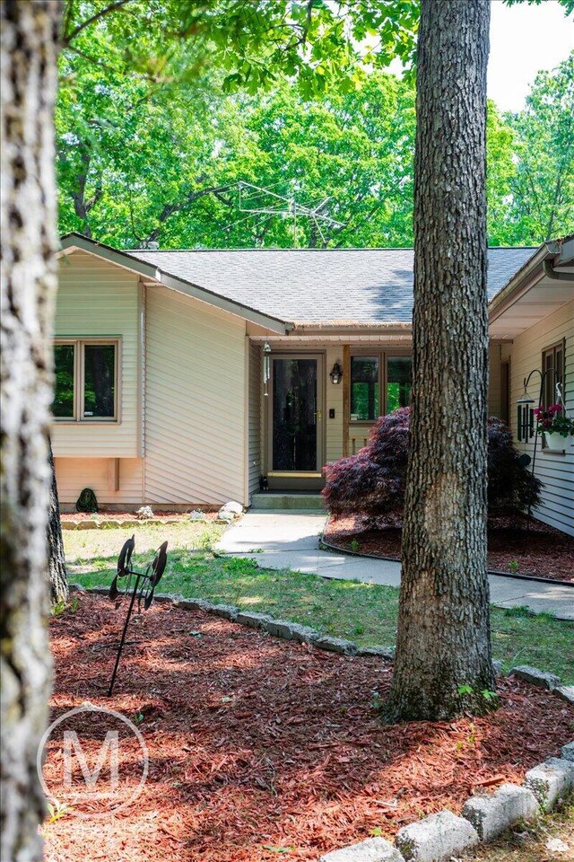 9057 Vergennes St SE, Ada, MI 49301 - view of front of property featuring a shingled roof