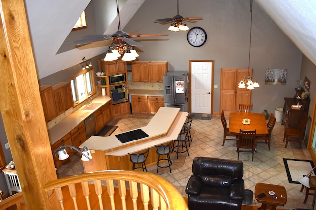 226 N 176th Ave, Walkerville, MI 49459 - kitchen featuring appliances with stainless steel finishes, high vaulted ceiling, light countertops, and a ceiling fan