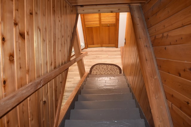 226 N 176th Ave, Walkerville, MI 49459 - staircase with wood walls and wood finished floors