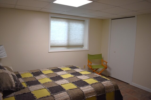 226 N 176th Ave, Walkerville, MI 49459 - bedroom featuring tile patterned flooring and a paneled ceiling