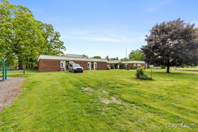 306 W Russell St, Hubbardston, MI 48845 - view of green lawn