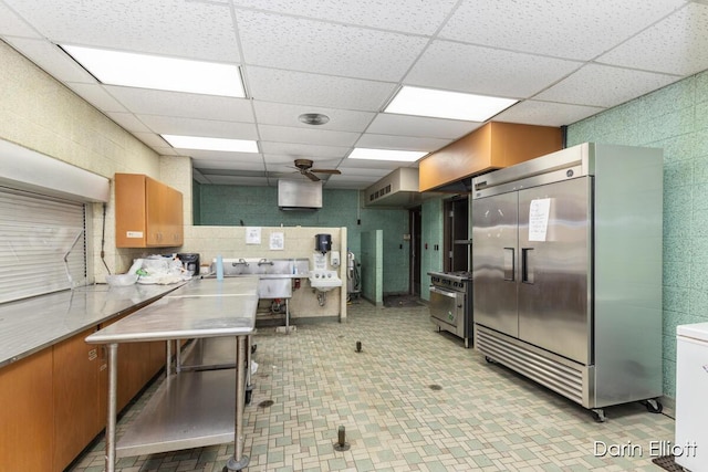 306 W Russell St, Hubbardston, MI 48845 - kitchen with high end refrigerator, tile walls, brown cabinetry, a paneled ceiling, and light countertops