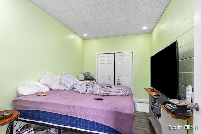 306 W Russell St, Hubbardston, MI 48845 - bedroom with a closet, recessed lighting, wood finished floors, and baseboards