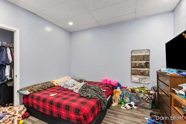 306 W Russell St, Hubbardston, MI 48845 - bedroom featuring wood finished floors, a drop ceiling, and recessed lighting