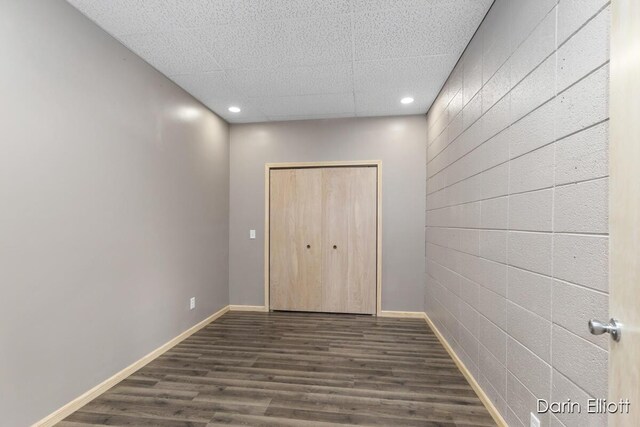 306 W Russell St, Hubbardston, MI 48845 - unfurnished bedroom featuring dark wood-style flooring, recessed lighting, a closet, and baseboards