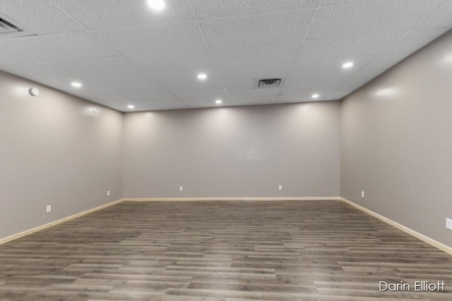 306 W Russell St, Hubbardston, MI 48845 - empty room featuring wood finished floors, baseboards, recessed lighting, and a paneled ceiling