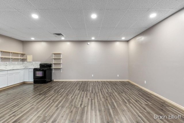 306 W Russell St, Hubbardston, MI 48845 - unfurnished living room featuring recessed lighting, wood finished floors, and baseboards