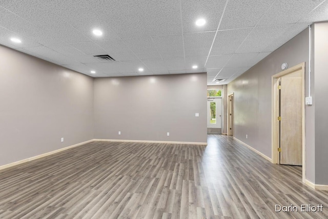 306 W Russell St, Hubbardston, MI 48845 - spare room featuring wood finished floors, baseboards, and recessed lighting